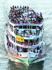 An overcrowded passenger boat is seen on the Buriganga River in Dhaka on Monday. Millions of residents in Dhaka have started the exodus home from the capital city ahead of the Eid ul-Fitr holiday.  Reuters