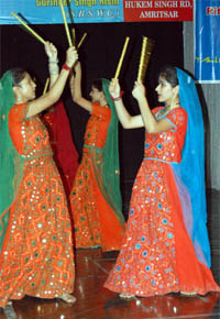 Girl students perform dandia during a cultural programme at the BBK DAV College for Women in Amritsar.