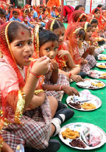 Food being offered to girls during the Kanjak Pooja on the occasion of first day of navratra and Aggarsein Jayanti celebrations at Aggarsein Bhawan in Bathinda on Tuesday.
