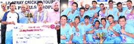 H.K. Dua, Editor-in-Chief of The Tribune, presents a cheque to the captain of the IOC team at the PCA Stadium in Mohali on Tuesday; and (right) players of the team