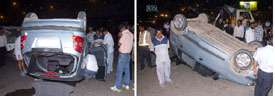 A car overturns after hitting a tempo at the national highway of Rajiv Chowk in Gurgaon on Monday night. 