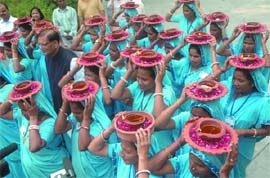 Liberated women scavengers from Alwar with Bindeshwar Pathak, founder of Sulabh International, on the eve of Gandhi Jayanti in New Delhi on Wednesday. 