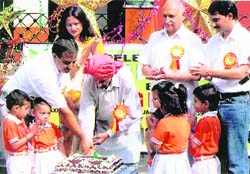 Fouri Sharan, the oldest inmate at the Home for the Aged at Amphala (Jammu), cuts a cake in celebration of World Elders Day