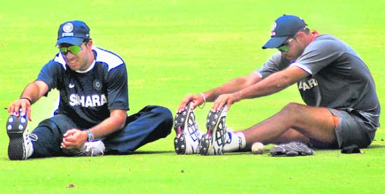 Board Presidents XI captain Yuvraj Singh with a teammate at a practice session at Rajiv Gandhi International Cricket Stadium in Hyderabad on Wednesday.  PTI