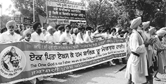 Participants at a march organised to commemorate the tricentenary of the installation of the Gurugaddi by the Shatabdi Purab Committee, Mohali, on Thursday.
