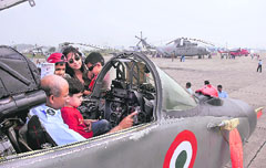 An officer shows gadgets in the cockpit of a fighter aircraft during a static display of IAF aircraft and equipment at the Air Force Station in Chandigarh on Thursday.