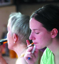 A foreigner flouts ban on smoking in public places, as she smokes on a road in New Delhi 