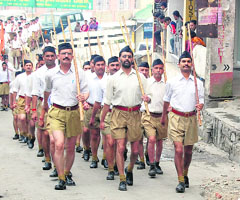 Members marching on the RSS sathapna divas in Shimla on Thursday.