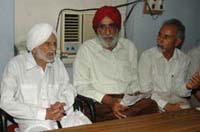 Desh Bhagat Yadgaar Committee chief Baba Bhagat Singh Bilga (L) during a press meet in Jalandhar.