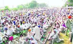 Farmers block the Moga-Ludhiana rail line at Ajitwal in Moga