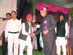 Chief Minister Prem Kumar Dhumal honours the states oldest ex-serviceman, Pyaar Singh (103), at Kangra on Friday.