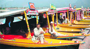 Shikarawalas wait for tourists in Srinagars Dal Lake. 