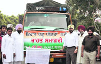 MLA Jassi Khangura flags off a truckload of relief material for flood victims.