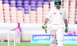 Australia captain Ricky Ponting walks back to pavilion after being bowled by Board President XI's Piyush Chawla on the second day of the four-day warm up match in Hyderabad