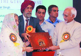 Vice-president Hamid Ansari and Gursharan Kaur release a book on Guru Granth Sahib The Guru Eternal by Mohinder Singh at a function in New Delhi on Saturday.