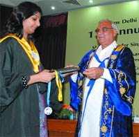 Haryana Chief Minister Bhupinder Singh Hooda presents medal to a student at the 11th annual convocation of New Delhi Institute of Management in New Delhi on Saturday.