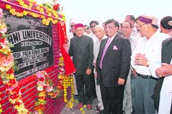 Chief Minister Prem Kumar Dhumal laying the foundation stone of Arni University in Mandh in Kangra district. A Tribune photo 