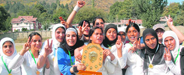 Players of the Srinagar women cricket team after winning the trophy of Under-19 Inter-district Cricket Tournament in Srinagar on Saturday.