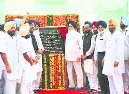 Chief Minister Parkash Singh Badal inaugurates an overbridge at Dhuri on Saturday. Tamil Nadu Governor Surjit Singh Barnala and union minister Naranbhai J. Rathwa are also seen in the picture. 