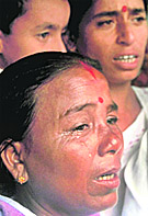 A riot victim breaks down while sharing her experience at a relief camp in Udalguri district of Assam on Sunday.