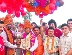 Beijing Olympics bronze medal winner Sushil Kumar is felicitated during the Navratra festival in Katra on Sunday. 