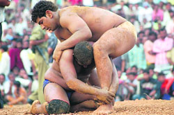 Krishan (in yellow) from India and Shaid in action in Katra on Sunday. 