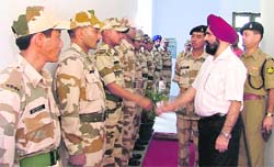 ITBP Inspector General (NW) P.P. Singh shakes hands with members of an expedition in Ludhiana