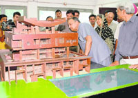 UT administrator S.F. Rodrigues has a close look at the model of the Governors house during the inauguration of the Le Corbusier Centre in Chandigarh on Monday.