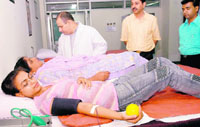Volunteers donate blood at the GMCH, Sector 32, Chandigarh, on Monday.