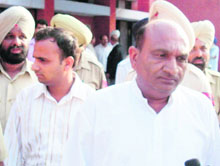 Mohali BJP vice-president Suresh Gupta and his son Rohit being produced in Mohali courts on Monday.