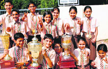 Jovial paddlers of Manav Mangal School, Sector 11, Panchkula, pose with trophies and medals won by them in the Haryana State Inter-District Table Tennis Championship.