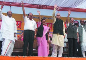 BJP prime ministerial candidate L.K. Advani with Delhi chief ministerial candidate Vijay Kumar Malhotra and party leaders Sushma Swaraj, Harsh Vardhan, Vijay Goel and others at the 'Vijay Sankalp Rally' in New Delhi on Monday. Tribune photo