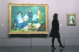 A visitor walks past a painting by Spanish artist Pablo Ruiz Picasso (1881-1973) exhibited at the Grand Palais Museum in Paris. The exhibition would be on till February 2, 2009.