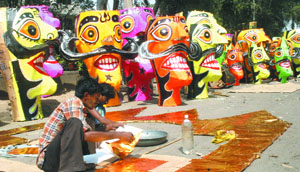 Artisans prepare effigies of Ravana, Meghnath and Kumbkaran, for Dussehra celebrations in New Delhi 