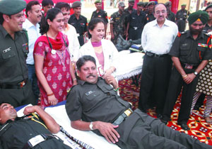 Former cricketer Kapil Dev, who has been recently appointed Lieutenant-Colonel in the Territorial Army, donates blood at a camp organised by the Territorial Army in New Delhi