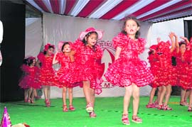 Students of La Montessori School, Kalehali, present a dance at the annual day function. Photo: Subhash Sharma