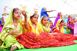 Tiny tots perform during a cultural fest at Manav Sehyog School. 
