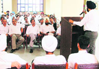 The DBA president addresses lawyers at a meeting convened to discuss security arrangements in court complex in Ludhiana on Tuesday.