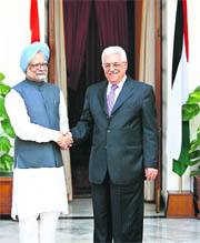 Palestinian President Mahmoud Abbas shakes hands with Prime Minister Manmohan Singh before their meeting in New Delhi on Tuesday.