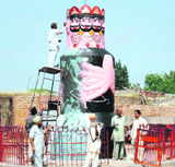 The statue of Ravana, which is situated in front of Ram Temple in Payal, gets a facelift on Tuesday.