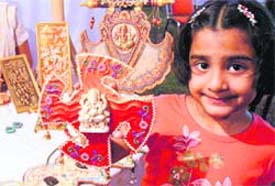 My Friend Ganesha: A tiny tot takes her pick at the handicraft section of the exhibition First Show being held at Hotel Mountview-10