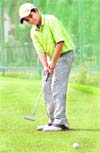 Piyush Sangwan putts on the Chandigarh Golf Club greens in the under-11 category of the Usha International Junior and Subjunior Golf Championship