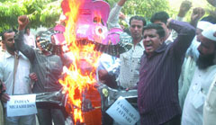 Muslim activists burn effigy of terrorism on the eve of Dussehra at Jantar Mantar in New Delhi on Wednesday.