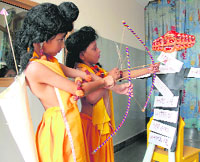Students of Doon Vatika Public School, dressed as Ram and Laxman, celebrate the Dussehra festival in Karnal on Wednesday.
