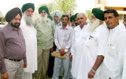 Punjab Mandi Board chairman Ajmer Singh Lakhowal being received on arrival at Abohar.