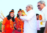 Artistes playing Lord Rama and Laxmana being garlanded by Haryana Chief Minister Bhupinder Singh Hooda in Chandigarh on Thursday.
