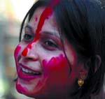 A Bengali woman celebrates with colour in New Delhi on Thursday. 