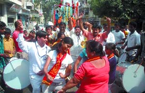Devotees celebrate the samadhi diwas of Sai Baba with a rath yatra organised by the Sree Sai Ma Palki Sewa Samiti at Adarsh Nagar in New Delhi on Thursday.