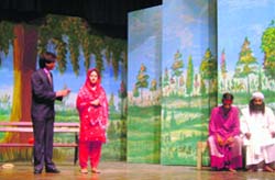 Artistes from Pakistan perform in 'Waris Shah', a play staged at University Campus School in Rohtak