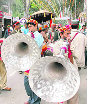 Devotees playing musical instrument called Thonkru during the Kullu Dussehra celebrations at Kullu on Thursday.